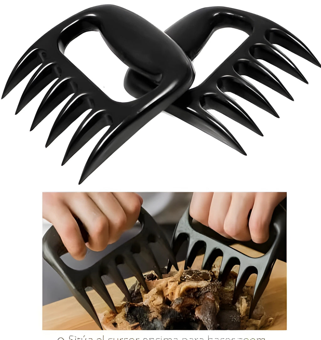 Two black bear claw meat shredding forks for barbecue and kitchen use on a kitchen counter.
