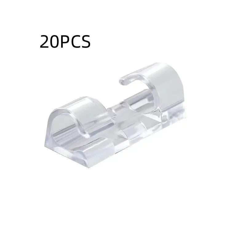 Transparent self-adhesive plastic cable management clips in four sizes on a white background.