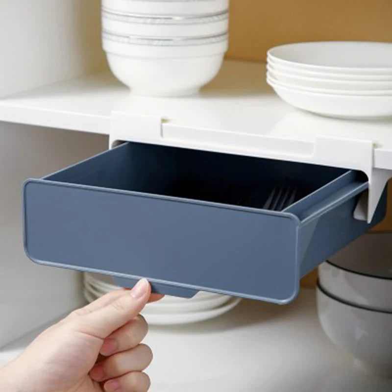 Under cabinet hanging storage box for kitchen utensils in white, green, and blue