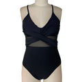 Women's mesh spliced backless one-piece swimsuit in solid black colour, polyester lined