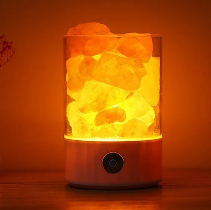 Himalayan salt lamp with natural pink-orange glow, releasing negative ions to purify the air and create a calming, relaxing atmosphere