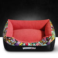 Pet litter mat in dark red cloth placed under a litter box to trap litter and debris