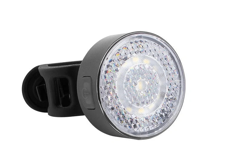 Bicycle LED headlight with clip attachment showing lens reflectors and USB port for charging