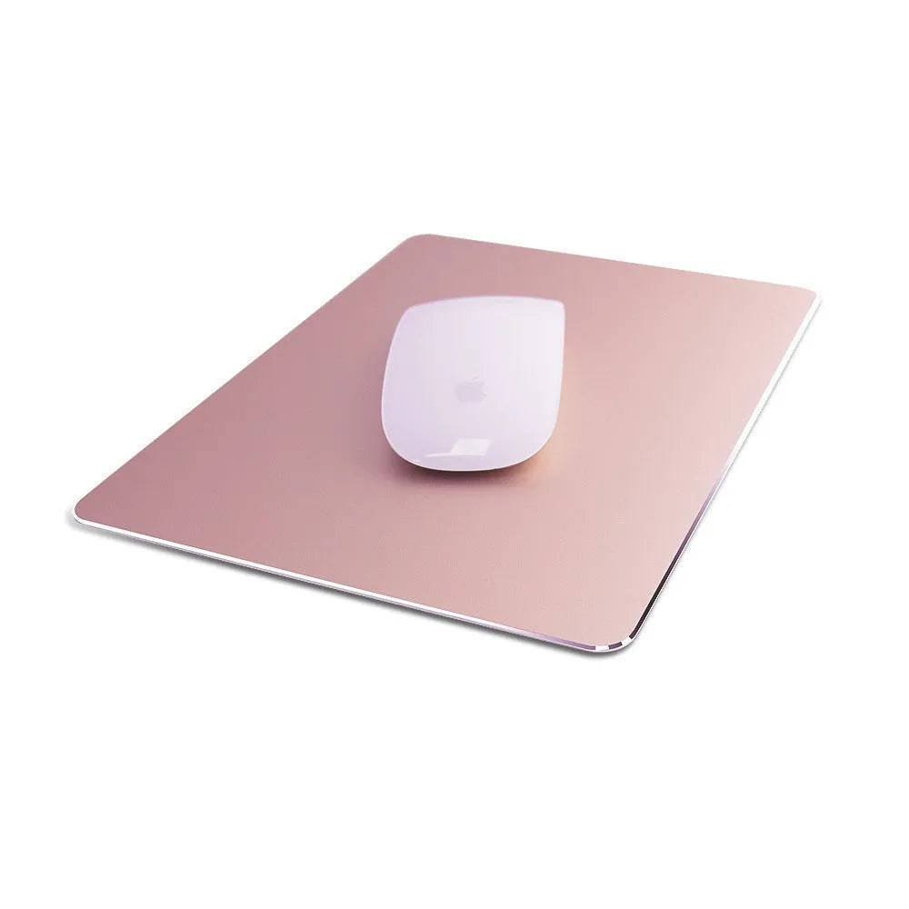 Double-sided aluminium mouse pad in black with non-slip base on a desk