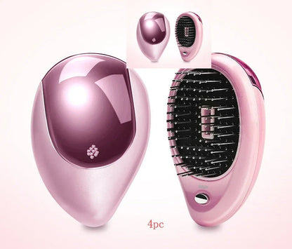 Portable negative ion hair comb with sound wave vibration technology in pink and green