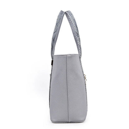 Elegant women's shoulder bag with zipper and organised pocket in light grey, black, off-white, and rose red
