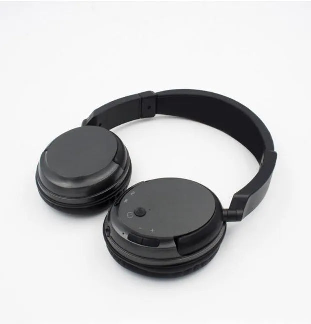 Black stereo wireless headset with USB FM transmitter and 3.5mm audio cable for dual wireless/wired operation