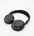 Black stereo wireless headset with USB FM transmitter and 3.5mm audio cable for dual wireless/wired operation
