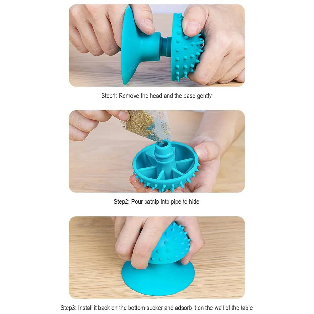 Blue cat self groomer mounted on wall with brush head and cat mint compartment