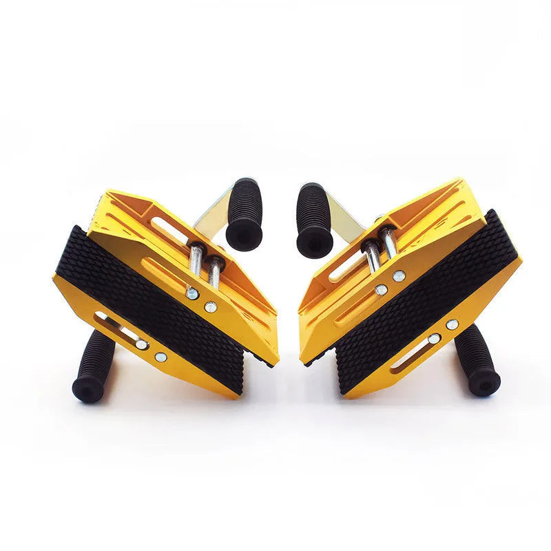 Yellow alloy steel two-hand marble handling clip with 150kg load capacity on stone surface
