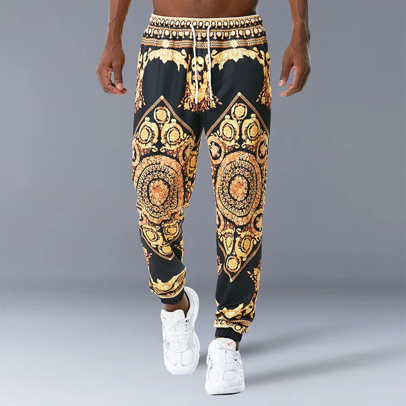 Printed jogging pants in loose fit with digital print pattern, mid waist, drawstring belt, and small-foot ribbed hem