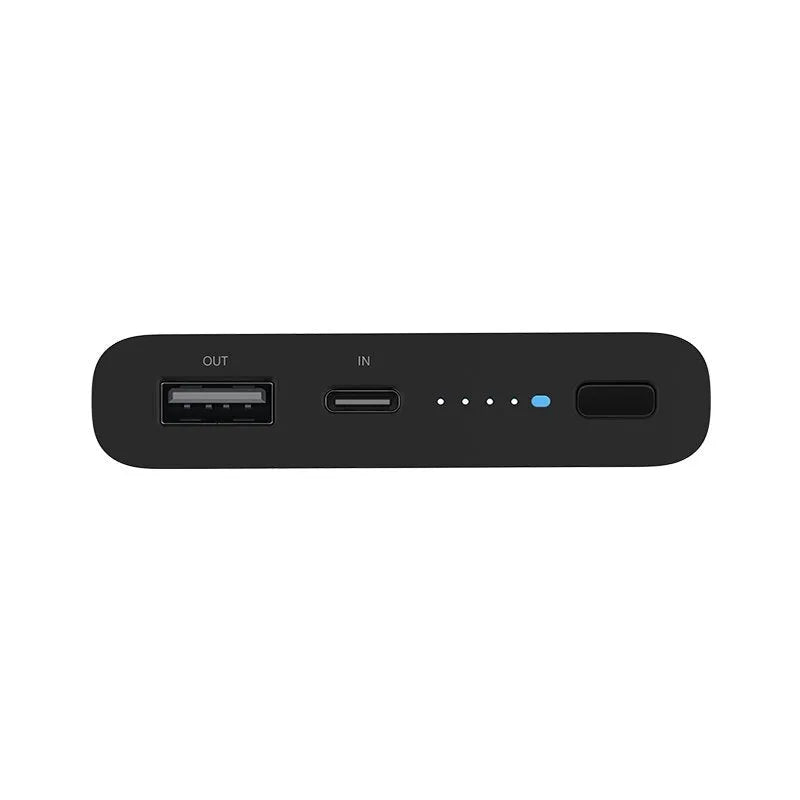 White or black 10000mAh power bank with USB port and wireless charging for tablets and phones.