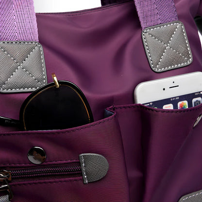 Ladies shoulder bag in black Oxford fabric, size M with multiple pockets and adjustable straps for handbag or crossbody carry, 340 mm width