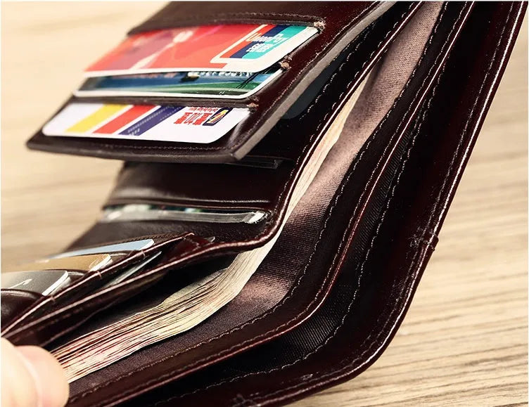 Men's leather wallet showing internal compartments including photo window, card slots and coin pouch