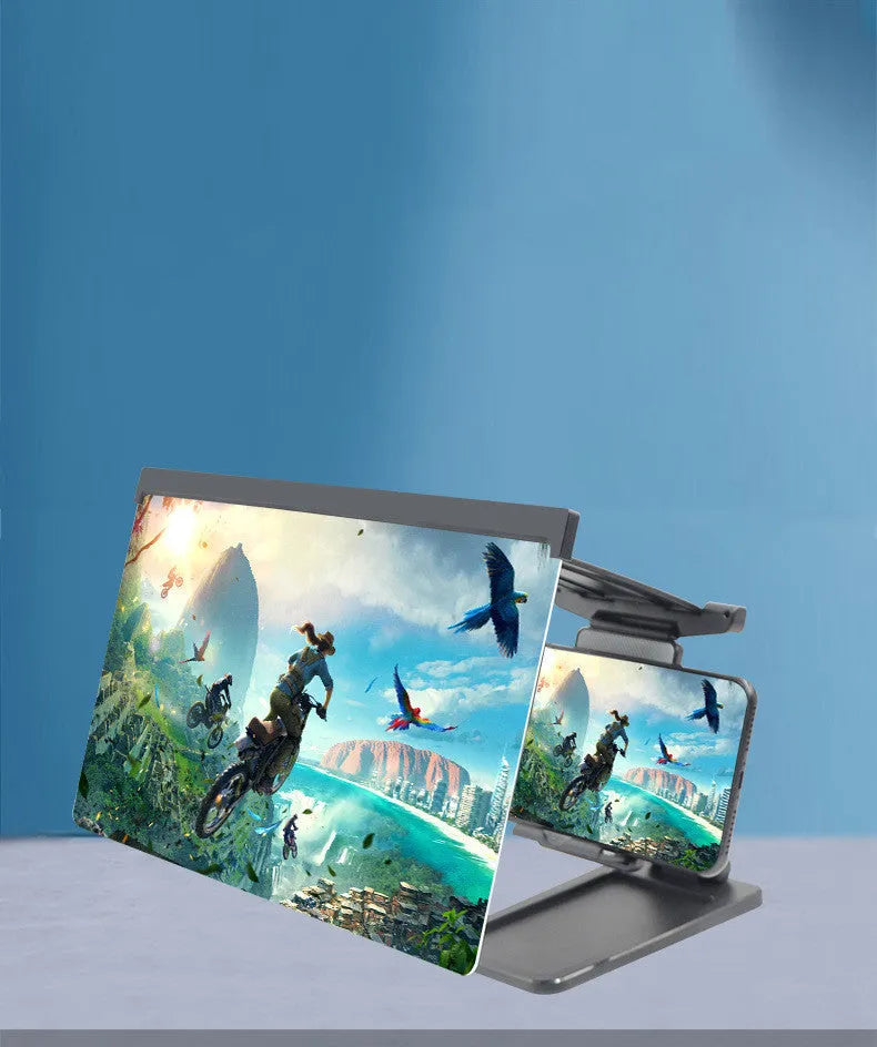 Black folding mobile phone screen magnifier and detachable holder on a desktop.