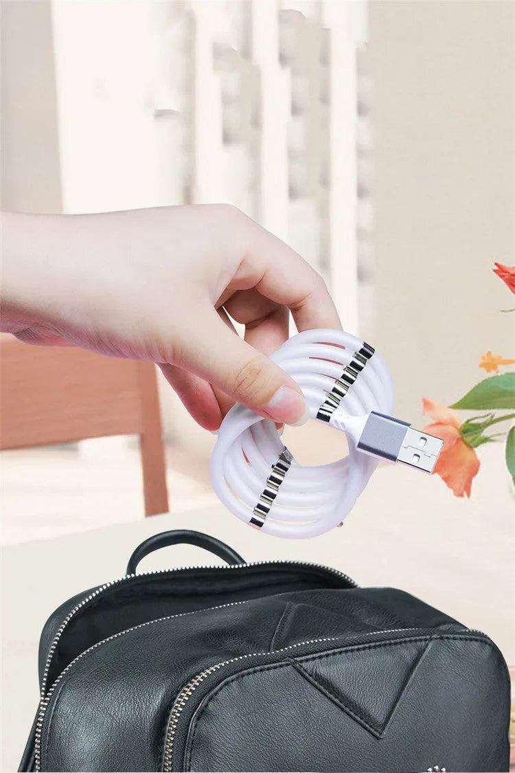 Black magnetic charging cable with Apple, Android, and Type-C compatibility showing aluminium alloy joints