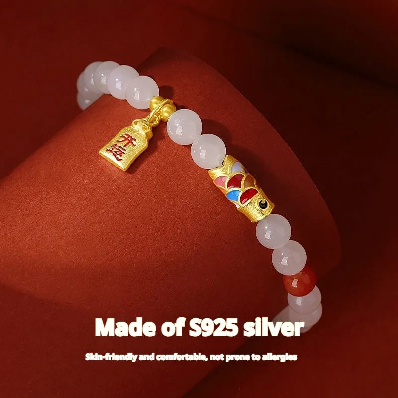 S925 sterling silver bracelet with a cold enamel crafted koi and natural Hetian jade element.