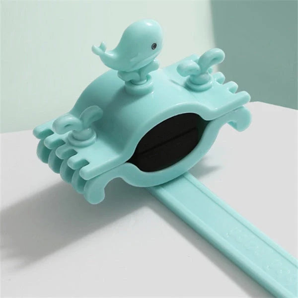 Children's faucet extender in blue, pink, and purple colours