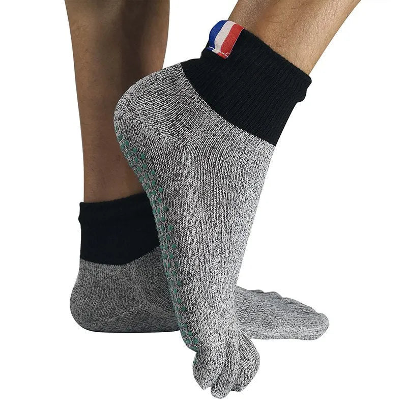 Grey five-toe cut-resistant anti-slip beach socks with non-slip silica gel sole against a neutral background