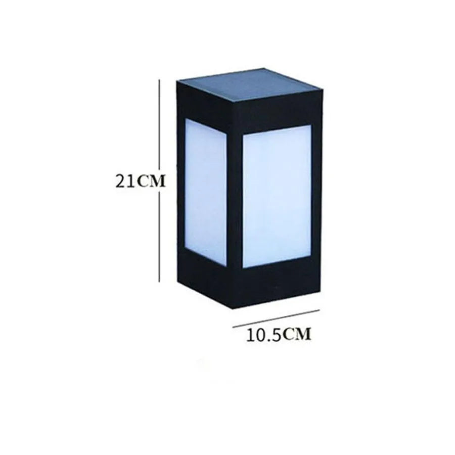 Solar-powered waterproof garden light installed on a lawn post providing white LED illumination.