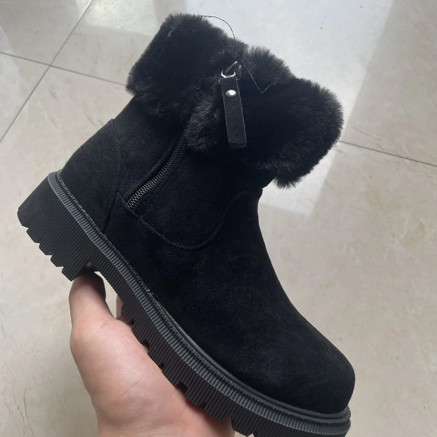 Stylish plush winter boots for women with side zipper, available in beige and black colors, featuring a suede upper and plush lining for maximum warmth and comfort.