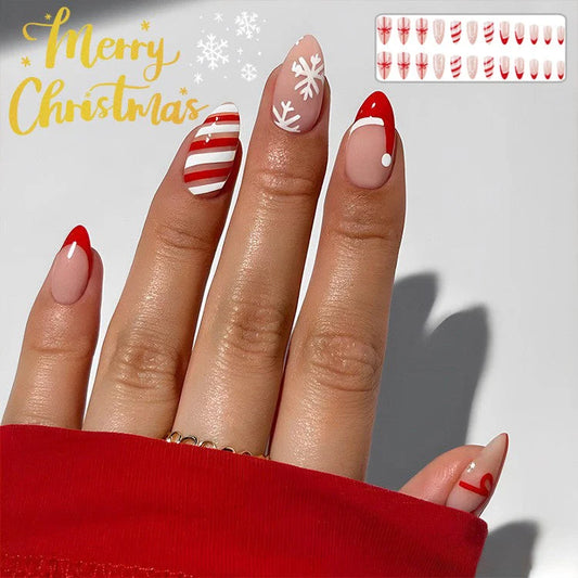 Christmas false nails with festive hat, striped, and snowflake designs for holiday parties