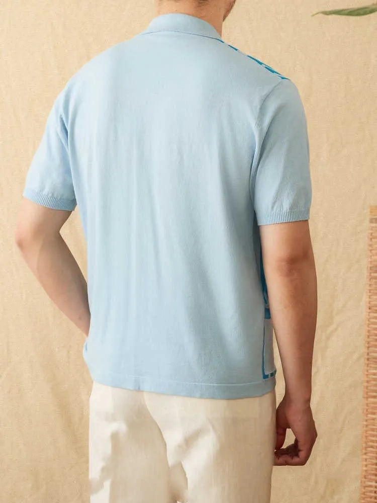 A striped royal blue short-sleeved polo cardigan shirt with a lapel collar, laid flat.