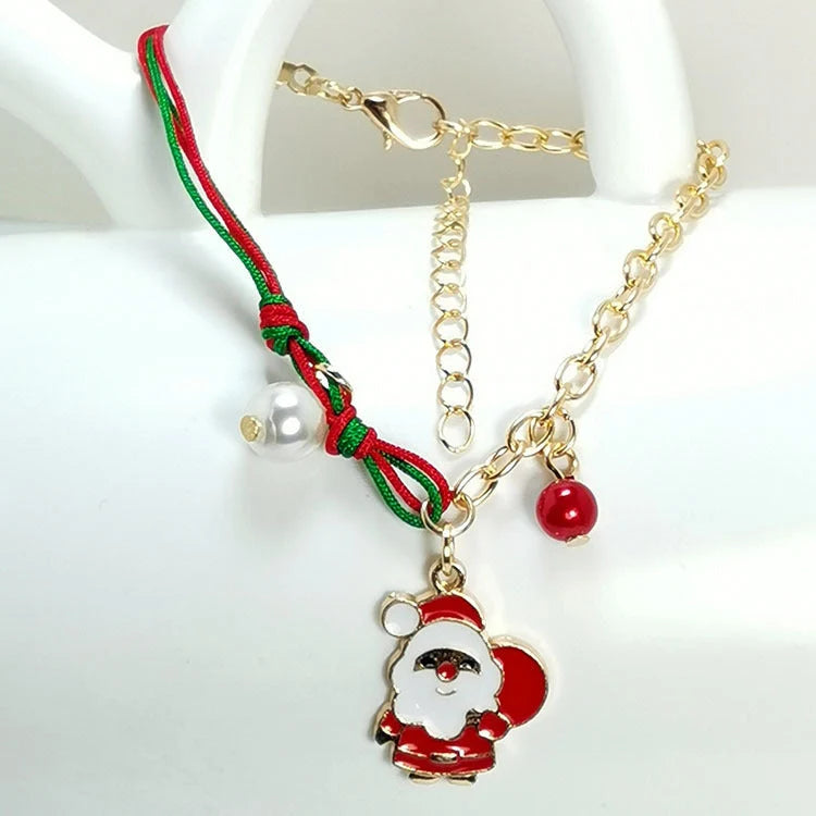 Christmas charm bracelet with snowman, Santa Claus, and snowflake designs