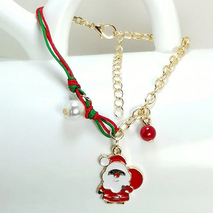 Christmas charm bracelet with snowman, Santa Claus, and snowflake designs