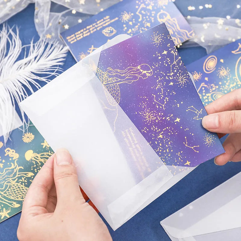 Set of three bronzed, pre-folded paper greeting card envelopes in one of four colour styles.