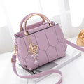 Women's polyester shoulder bag in solid colour with car seam detail and zipper closure, available in five colours