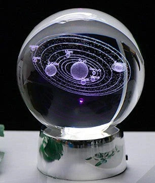 Mesmerizing Galaxy Crystal Ball made with premium K9 crystal, showcasing swirling celestial patterns and available in various sizes and base options.
