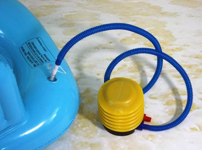 Inflatable water lounge chair in blue, floating in pool with hammock design visible