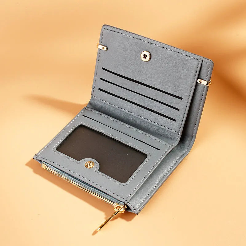 Ladies fold wallet in PU leather with zipper closure, showing internal card slots and compartments.