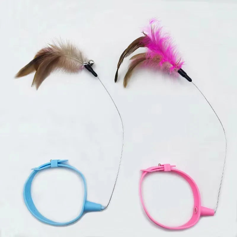 Blue adjustable cat collar with feathers and bell, plus a teasing wand with a soft silicone tip.