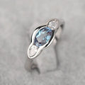 Women's geometric ellipse ring with zircon stone in white gold colour finish on model finger