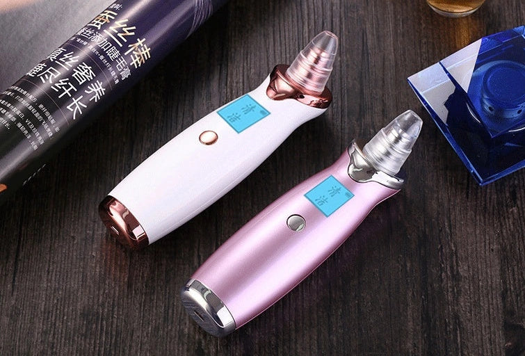 Blackhead vacuum cleaner with digital display showing 53KPa suction power and rose gold finish