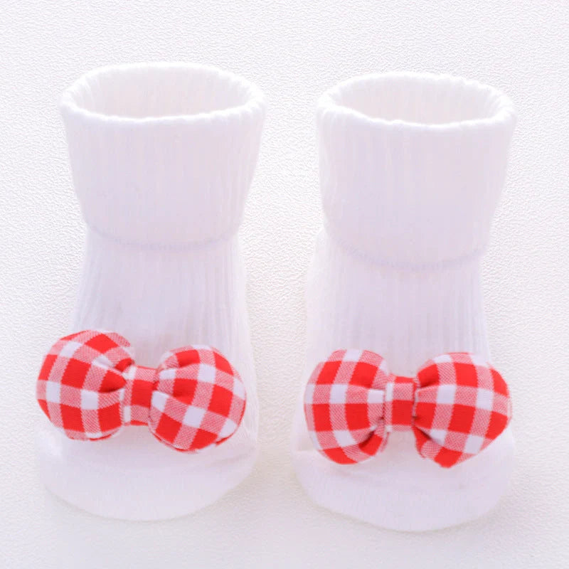 Cotton baby socks in various designs for newborns to 3-month-olds