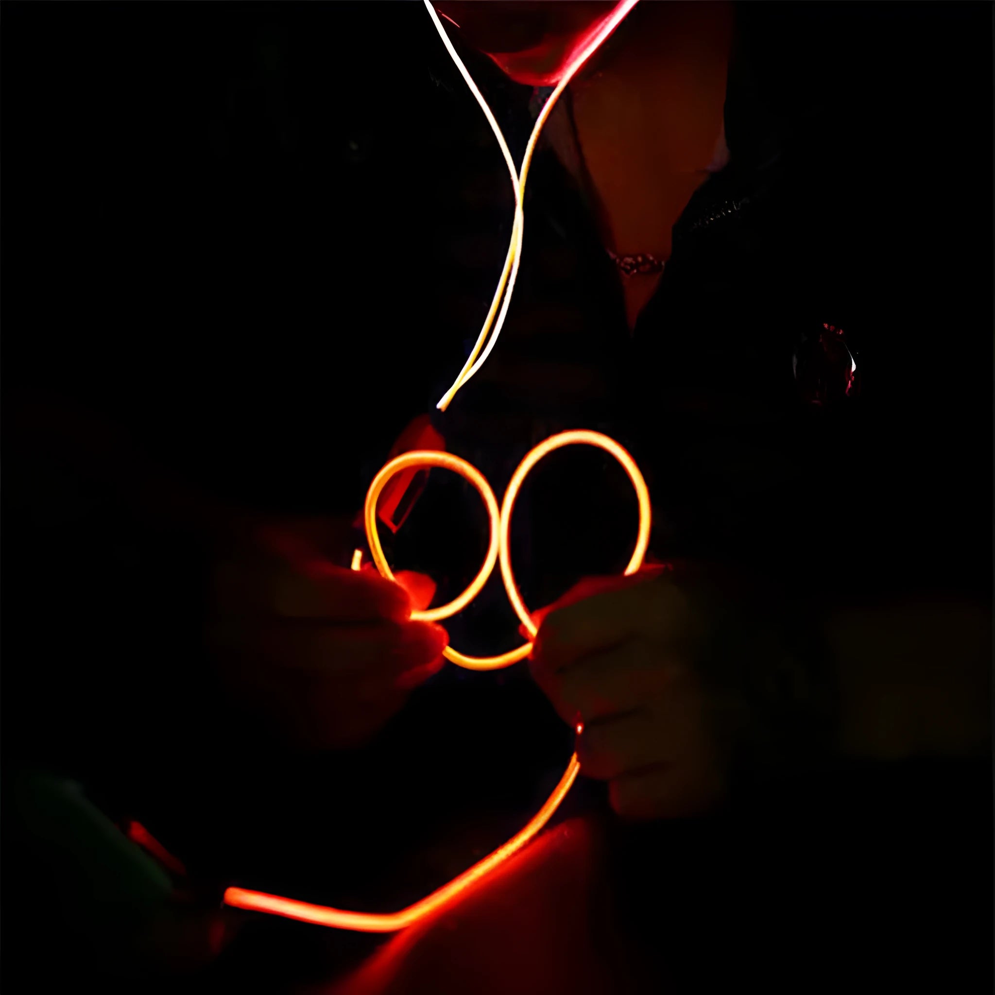 Blue Magic Light LED earphones with illuminated shells and a 3.5mm plug, showing the inline remote control.