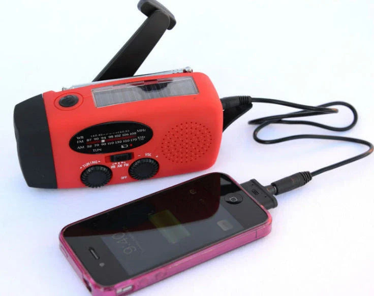 Versatile solar and hand-crank powered radio, flashlight, and USB charger with rugged ABS construction and dual charging capabilities