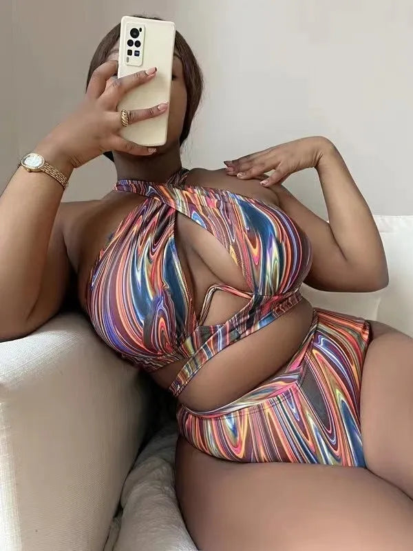 Women's floral print high-waisted bikini swimsuit with split sides.