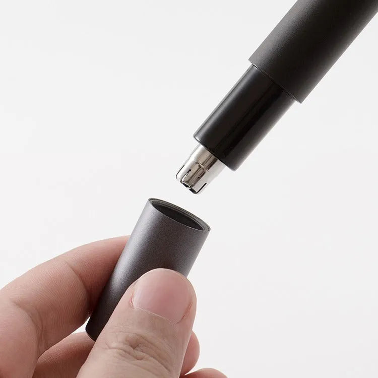 Black electric nose hair trimmer with ABS body on white background