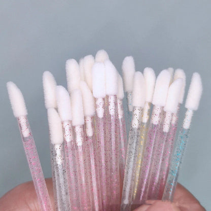 Crystal rod lip brush with synthetic fibre bristles in six colour options on white background