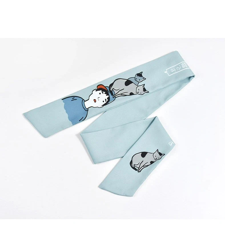 Blue and yellow cloth cat hair band with original tiara design measuring 3cm wide