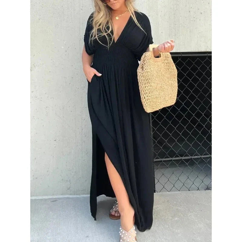 Stylish summer dress featuring unique bat sleeves, v-neck, slit design, and elastic waist for a flattering fit