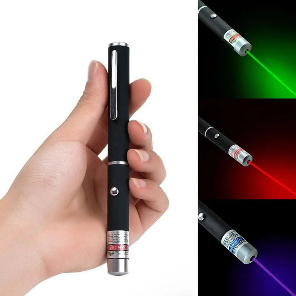 Black 5mW laser pointer pen with copper and aluminium body, red dot beam visible on dark surface