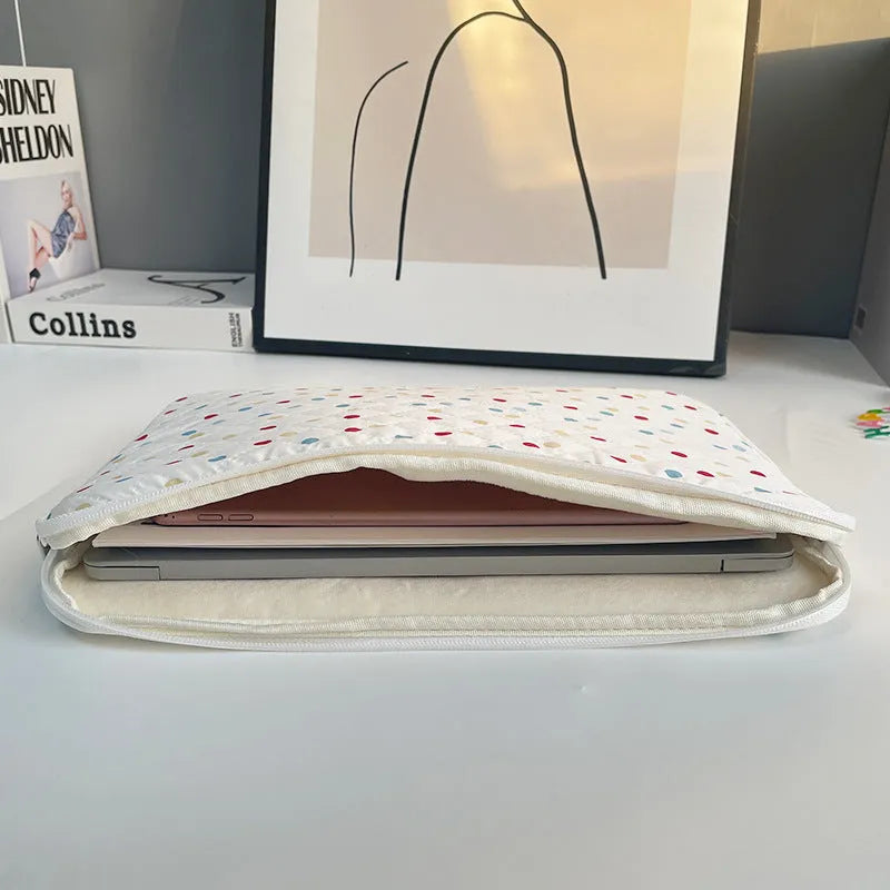 Women's polka dot polyester laptop bag shown in a solid colour, suitable for a 15.6 inch device.