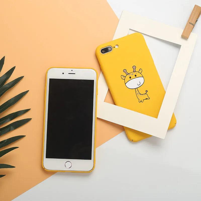 Yellow patterned hard plastic phone case for Apple iPhone models on a flat surface.