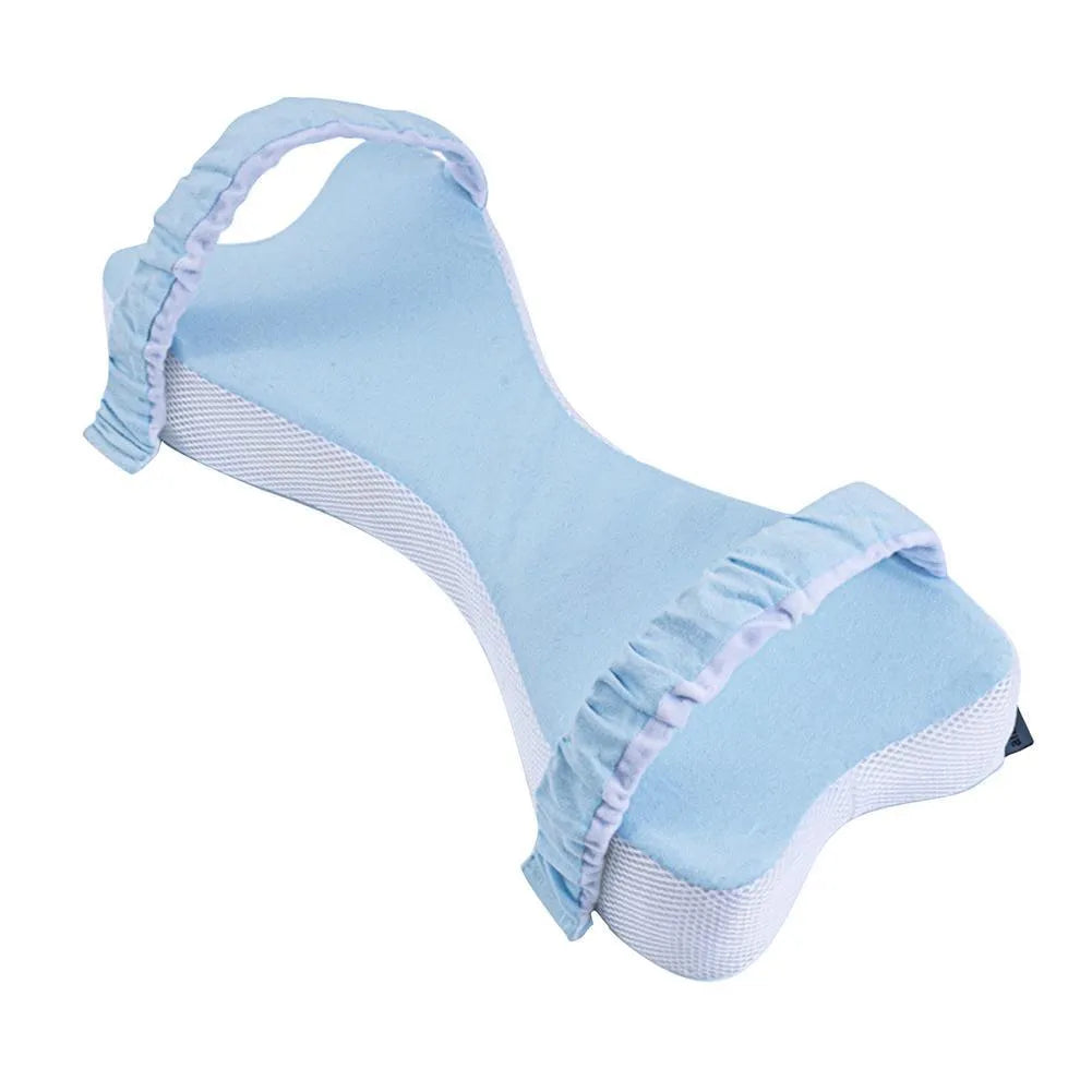 Memory cotton knee pillow in light blue on a bed, size 70x37x9cm for side sleeping support