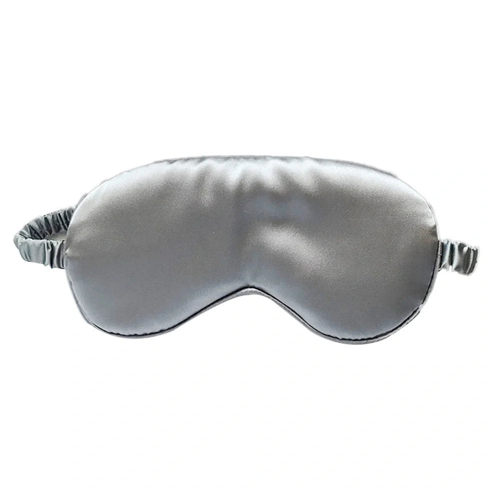 Silk double-sided eye mask in peacock blue and silver with adjustable strap, showing contoured nasal bridge design